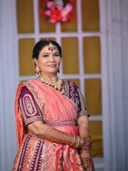 The mother of the groom, looking elegant and radiant. I created a classic, age-appropriate look that made her feel beautiful and confident for the baraat.