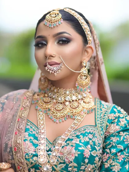 This shot highlights the dramatic smoky eye makeup. I use this technique to create a bold and captivating look for brides who want to make a statement.