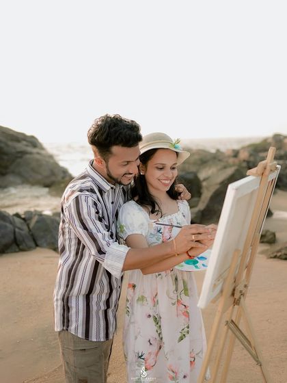A close-up of the couple collaborating on their artwork. It's a beautiful metaphor for building a life together.