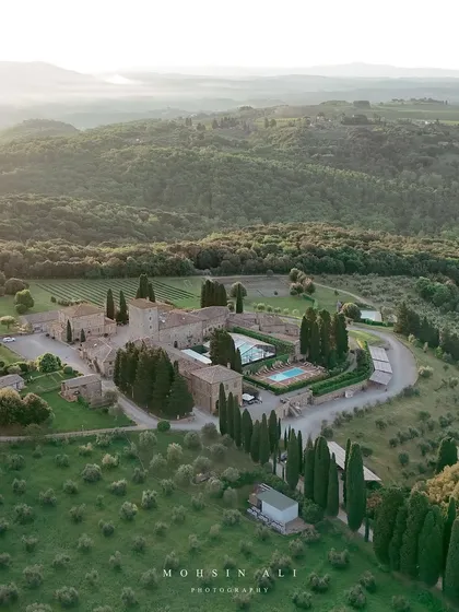 An aerial drone shot of the breathtaking wedding venue in Tuscany. This shows the scale and beauty of the locations we get to play at.