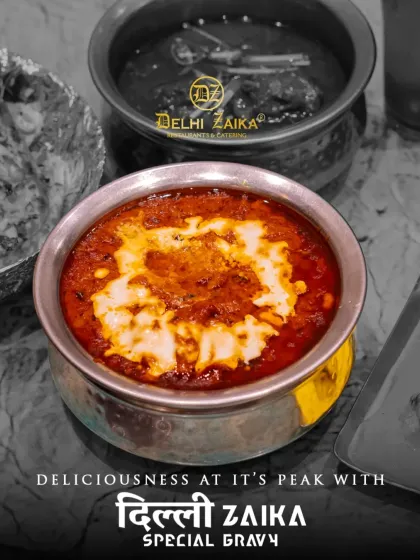 Deliciousness at its peak with our Dilli Zaika Special Gravy. This image highlights the vibrant color and creamy texture of one of our signature dishes.