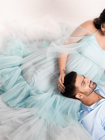 An intimate overhead shot of a couple with our Winter gown. The flowing tulle creates a beautiful, soft nest around them.