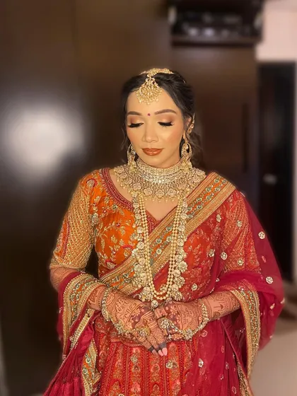 A full portrait of Purva, looking every bit the royal bride in her traditional attire and my signature glowing makeup.