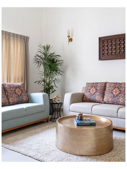 A cherished wooden piece, the first furniture the clients bought as a married couple, repurposed as wall art. This personal touch encapsulates treasured memories and adds emotional depth to the family lounge.