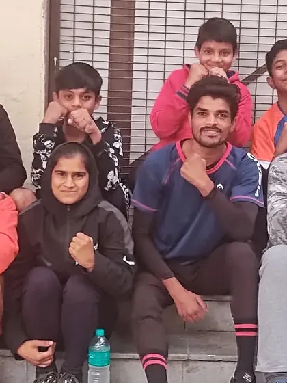 A group of our young boxers taking a break after a morning training session. This is where friendships are forged and the next generation of champions supports one another.