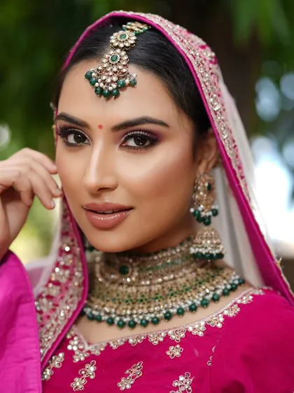A close-up portrait that captures the flawless base and soft contouring. These are essential techniques for any bridal makeup artist.