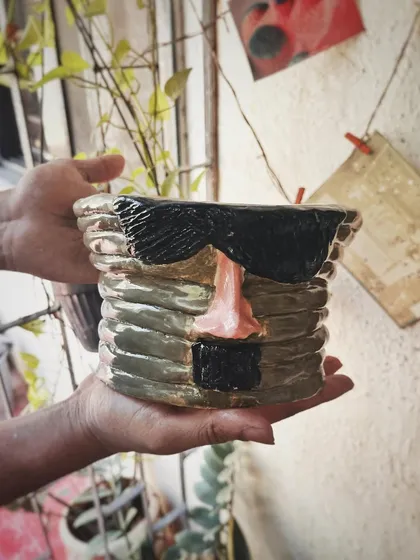 This student started with a one-time workshop and came back to begin his pottery journey. His pieces, like the quirky radio and the massive planter, are full of fun and character.