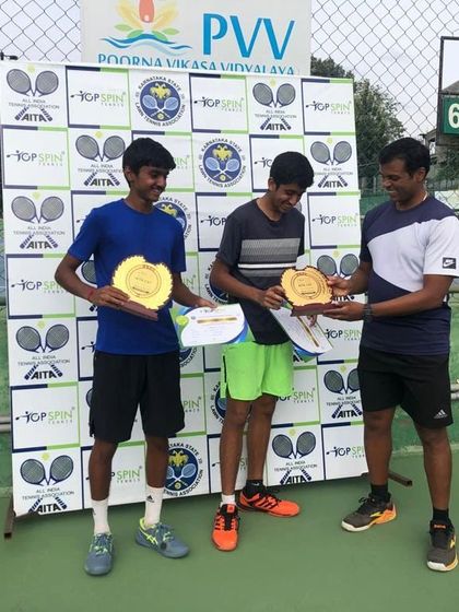 Our junior players Aarush and Sanchith receiving their trophies after winning the CS7 U-18 doubles tournament.
