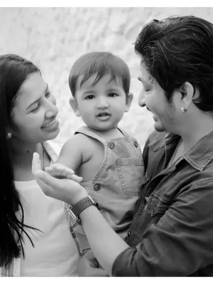A candid black and white portrait of a young family. These relaxed sessions, whether at home or outdoors, are perfect for capturing your family's natural interactions.