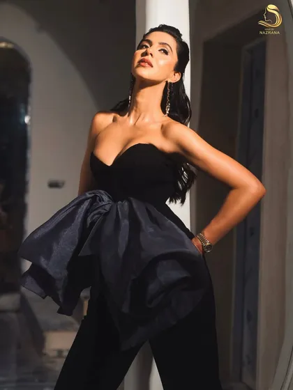 This couture look is all about drama, and the hair plays a key role. The textured waves add to the powerful and high-fashion aesthetic.