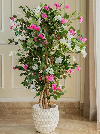 Enjoy the beauty of nature without the upkeep. This artificial bougainvillea tree is incredibly lifelike, with vibrant pink and white blossoms that bring a fresh, summery feel indoors all year round. It's a perfect, no-maintenance solution for adding a pop of color to your living room or balcony.