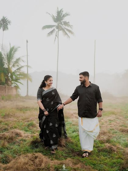 A walking shot that captures their easy-going chemistry and the beauty of their coordinated traditional outfits.