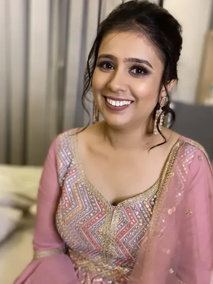 A beautiful smile from my cocktail party bride. The makeup is designed to be elegant and photo-ready for her evening celebration.