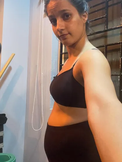 This is me, bloated during ovulation. It's completely normal, and it's important to see the reality behind the filtered fitness world. Your body will fluctuate, and my coaching is about embracing the process and focusing on consistent, healthy habits, not chasing a perfect body 24/7.