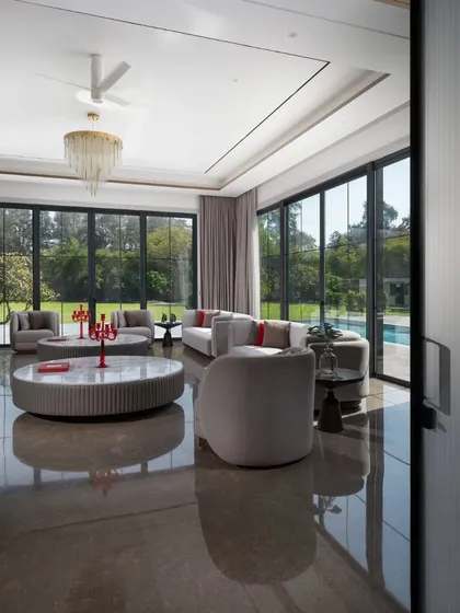 "A morning glory at my window satisfies me more than the metaphysics of books." This quote by Walt Whitman perfectly captures the feeling of this living room, where the beauty of the outdoors is the main event.