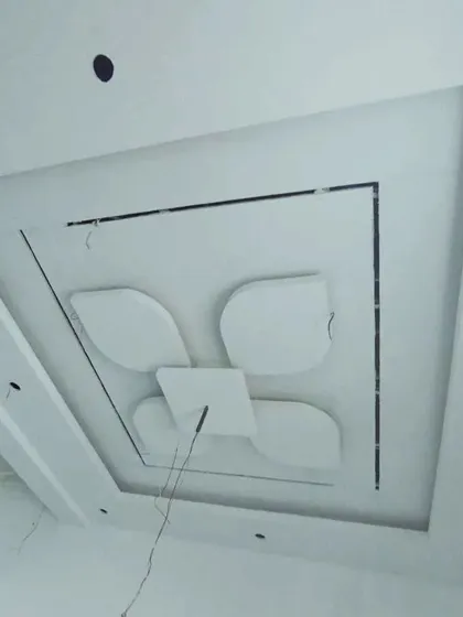 A floral-inspired design within a square frame, constructed from gypsum board and ready for the next stage of finishing.