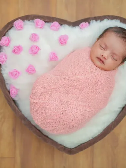 The wooden floor provides a warm, natural background for this heart basket setup. Every element is carefully chosen to produce a high-quality, frame-worthy image.