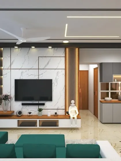 An open-plan living area where the TV unit, with its marble and wood finish, is complemented by a green sectional sofa and an adjacent crockery unit.