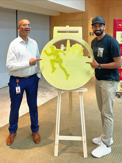 With an official from PNB, unveiling the medal for the PNB Half Marathon. As a Youth Ambassador, I am involved in key promotional activities for the event.