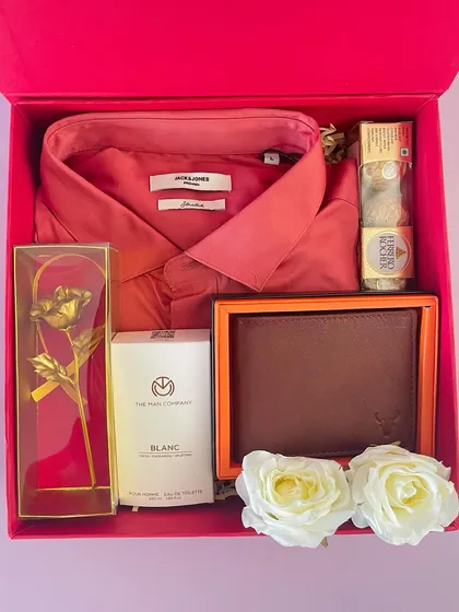 A premium Valentine's gift for him. This hamper includes a Jack & Jones shirt, a wallet, perfume, a golden rose, and Ferrero Rocher.