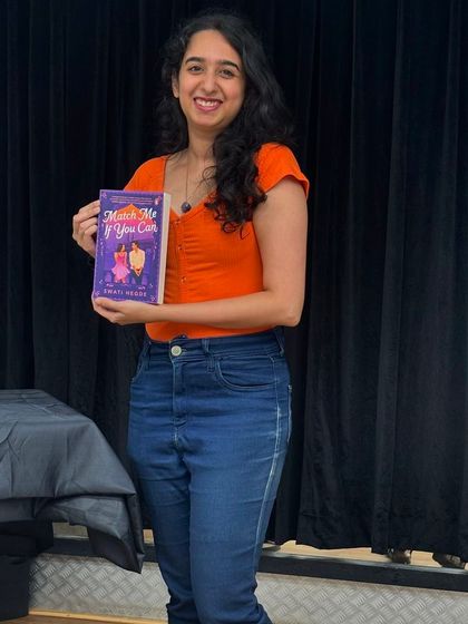 At an author event for a local book club. These intimate events are a great way to have in-depth conversations about my work.