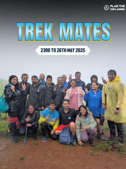 A group poses in their raincoats on a misty day, showing the fun of monsoon trekking.