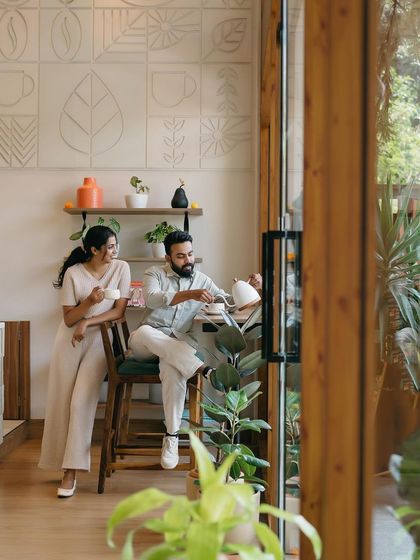 A duplicate of image 72, a quiet moment over coffee inside a beautifully designed cafe.