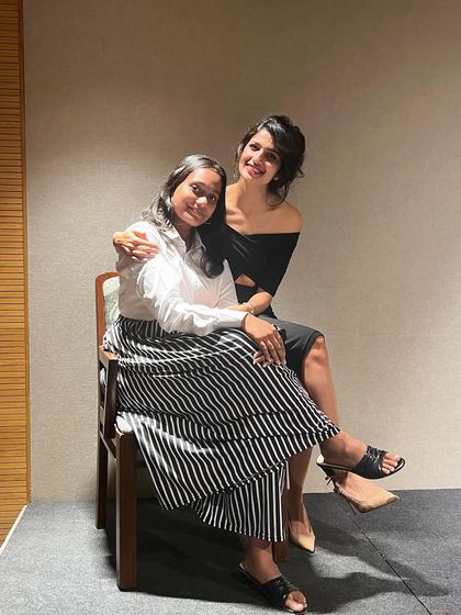 A moment of connection with an audience member on stage at the Atta Galatta event.