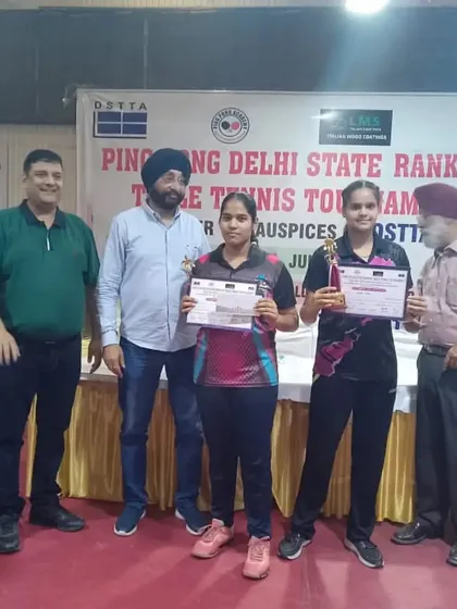 Ayushi on the podium with fellow competitors, recognized for her outstanding skill and determination in the state-level tournament.