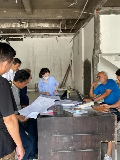 Here I am in a meeting on-site in Bali, reviewing blueprints with the local team for the Oriflame project. International projects require clear communication and hands-on coordination to align with the design and local regulations.