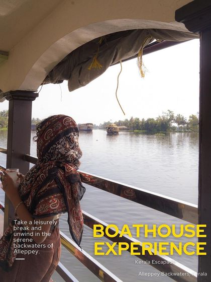 The iconic houseboat experience in the serene backwaters of Alleppey. A woman enjoys a quiet moment, taking in the tranquil beauty of God's Own Country.
