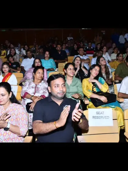 A shot of the proud parents and supporters in the audience, clapping and cheering for the young performers on stage. Their encouragement is the wind beneath our students' wings.