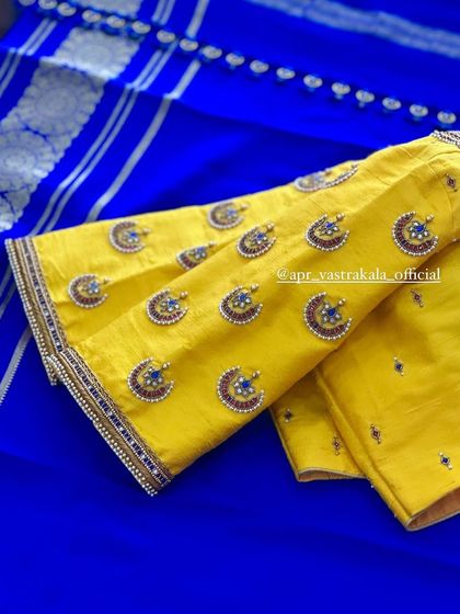 The sleeves of the yellow blouse, showing the scattered motifs.