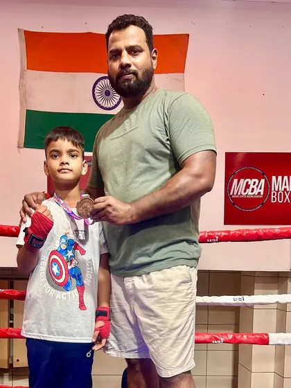 Coach Darshak Pawase with our young state medalist, Devansh. The bond between a coach and student is key to success.