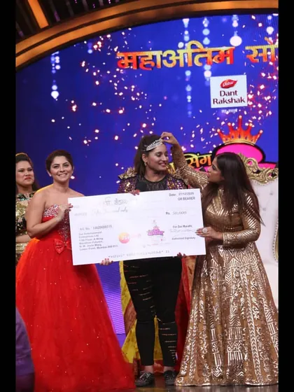 Holding the 2nd runner-up prize on the grand finale stage. This achievement is a huge part of my story and reinforces my mission to empower others through dance, regardless of their shape or size.