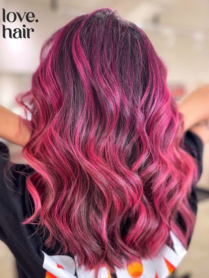 The back view of our all-time favourite pink balayage. The colour is vibrant, the waves are perfect, and the look is pure rock and roll.