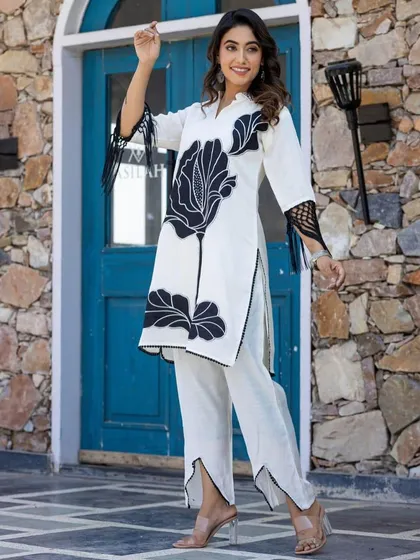 Here is a full view of my black and white floral cord set. This two-piece outfit includes a straight-fit kurta and matching pants, offering a modern and coordinated look that stands out from traditional ethnic wear.