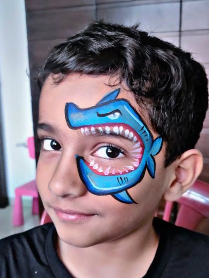 A very cool shark design where the child's eye becomes the eye of the shark.