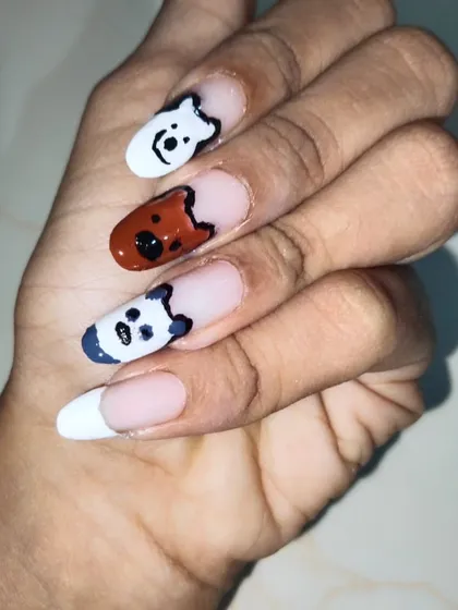 If you have a favorite cartoon, I can paint it. This client wanted a 'We Bare Bears' theme, so I hand-painted Ice Bear, Grizz, and Panda on different nails. This is a fun example of custom character art on gel extensions with a French tip base.