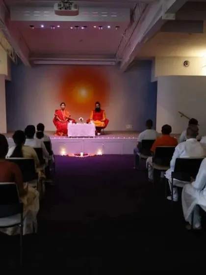 A view from the side of the stage during our Sydney meditation session, showing the calm and orderly environment we create.