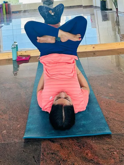 A student in Matsyasana (Fish Pose), a heart-opening pose that is often practiced with deep breathing. It's a beautiful way to find the present moment.