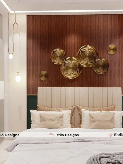 In this bedroom, I created a feature wall using a rich wood-tone panel and striking metallic art pieces. The pendant lights add a touch of modern elegance, while the neutral color palette keeps the space feeling calm and balanced.