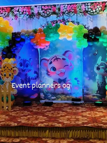 The full stage view of a cute jungle animal-themed first birthday party.