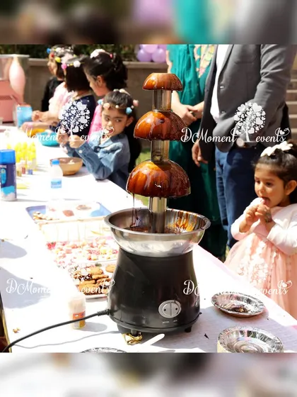 A party is all about the fun moments. Beyond decorations, I can arrange engaging food stations like this chocolate fountain, which is always a huge hit with kids and adds a delicious, interactive element to any celebration.