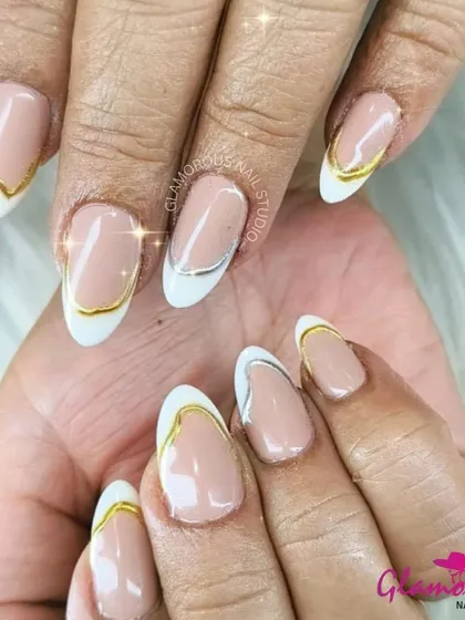 A truly elegant and modern take on the French manicure. This design features a classic white tip on an almond-shaped nail, outlined with a striking gold chrome line for a touch of luxury and sophistication.