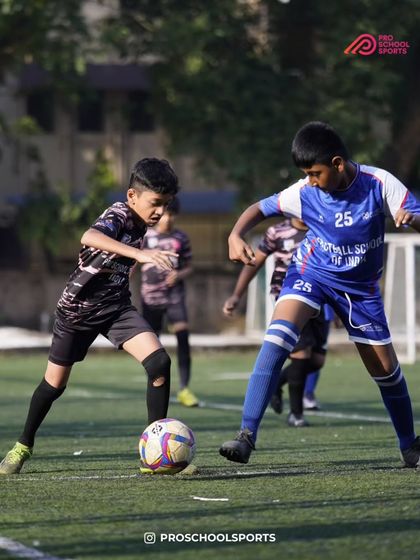 An intense one on one battle for the ball during the Monsoon League finals.