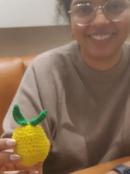 That priceless smile when you finish your first amigurumi project. This student proudly shows off the little lemon she made from scratch during our course.