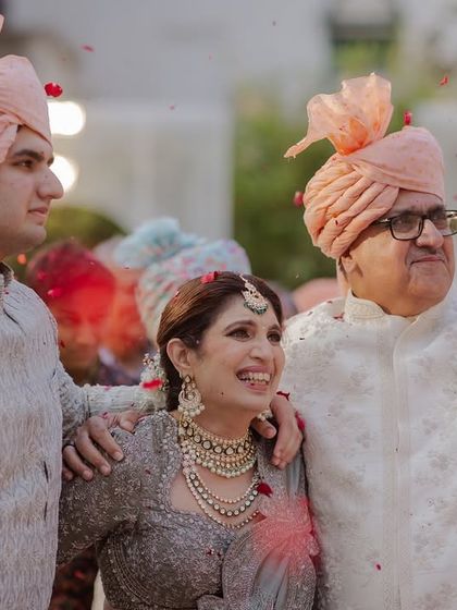 The proud family of the bride watching the Varmala ceremony with joy.