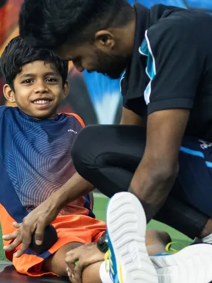 A crucial part of my coaching philosophy is connection. Here, one of my expert coaches works closely with a young athlete, ensuring he feels supported and understood. This personal guidance helps build confidence and makes the hard work of training an enjoyable process.