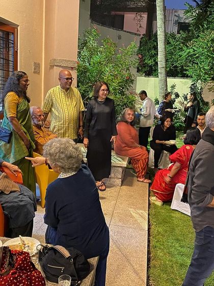 A dinner party held in honor of artist Gulammohammed Sheikh, bringing together the local art community.